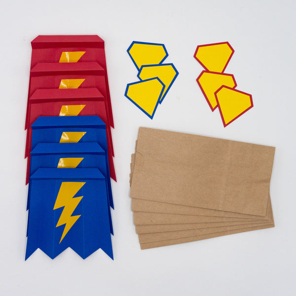 Superhero goodie bags. unassembled mini paper bags, capes, and shields. For filling with party favors.